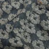 Pantalones holgados de Denim con diseño de guirnalda en jacquard