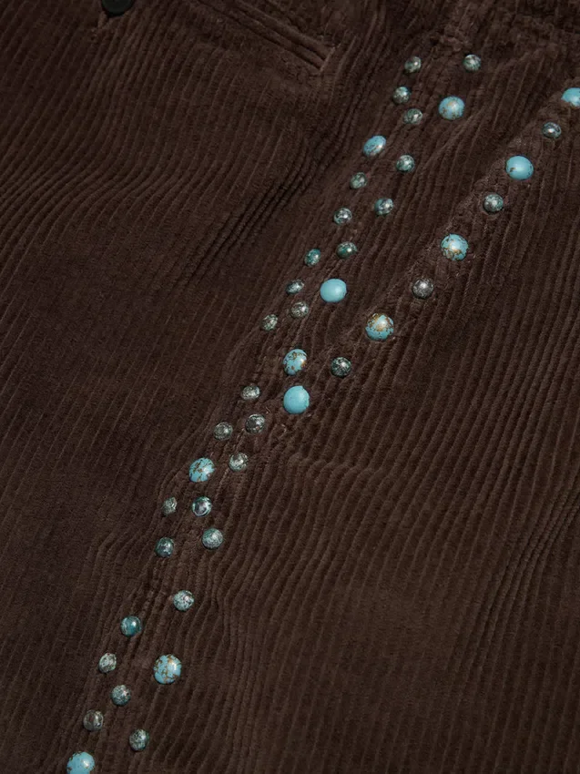 Shorts de pana con tachuelas oxidadas